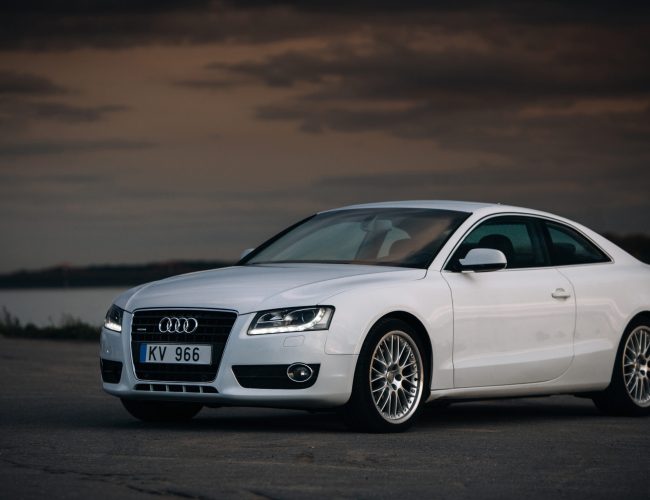 Audi A5 Coupe near the river at the evening